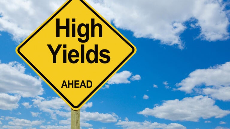 Road sign indicating high yields ahead for savings accounts.