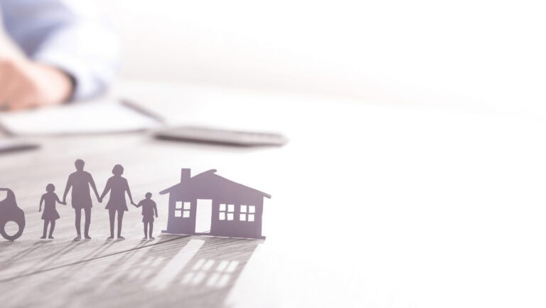 Family holding hands with house and car icons for financial planning.