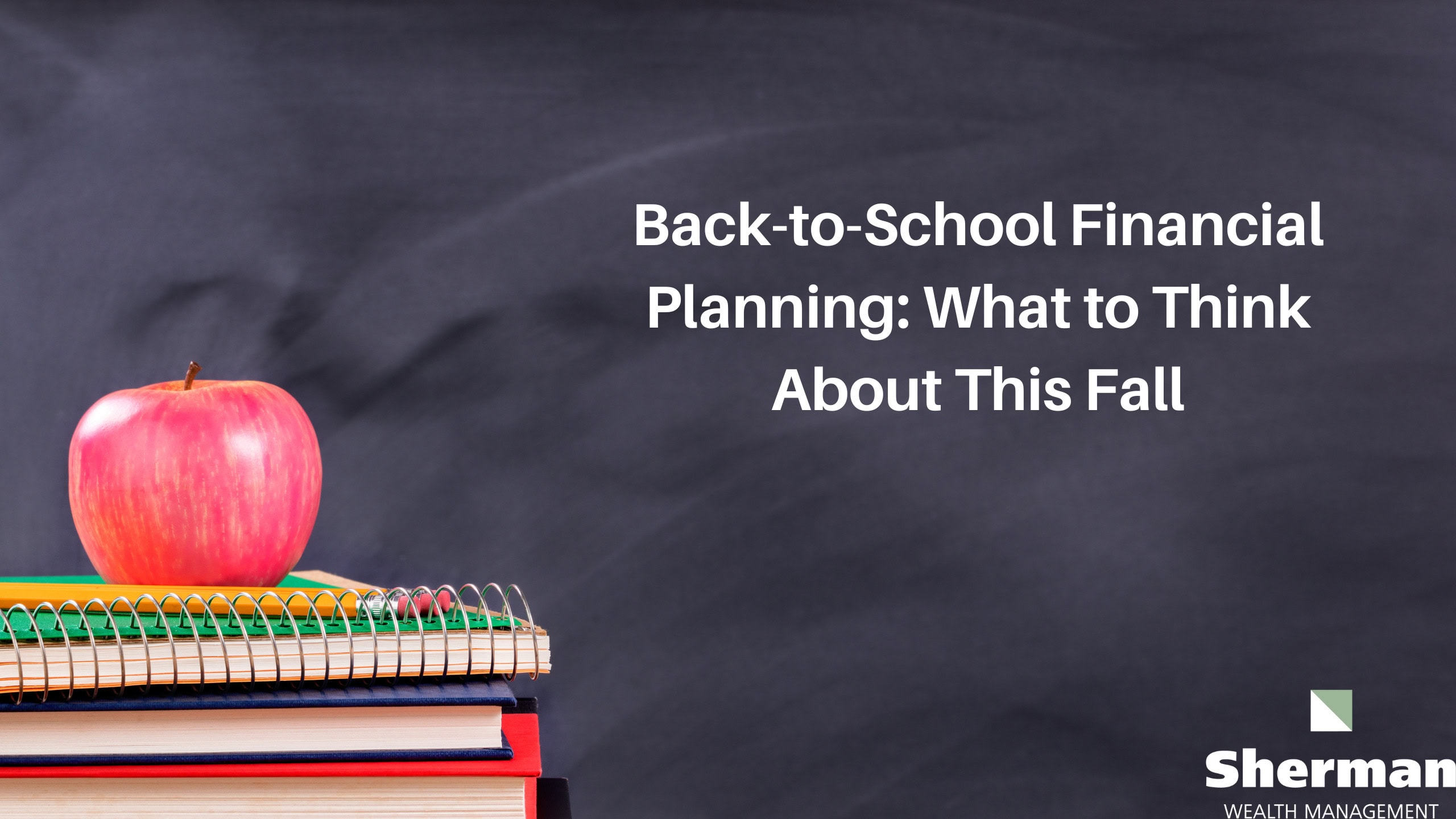 Apple on school supplies with chalkboard background for financial planning.