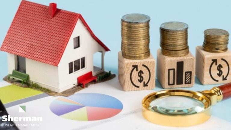 Model house on stacked coins beside financial planning documents for year-end planning